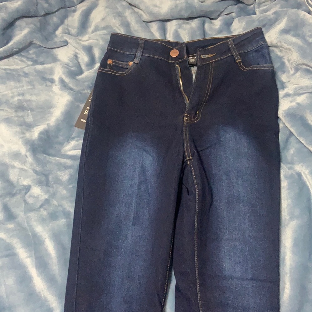 Dark blue high rise stretch jeans. Size 9/10